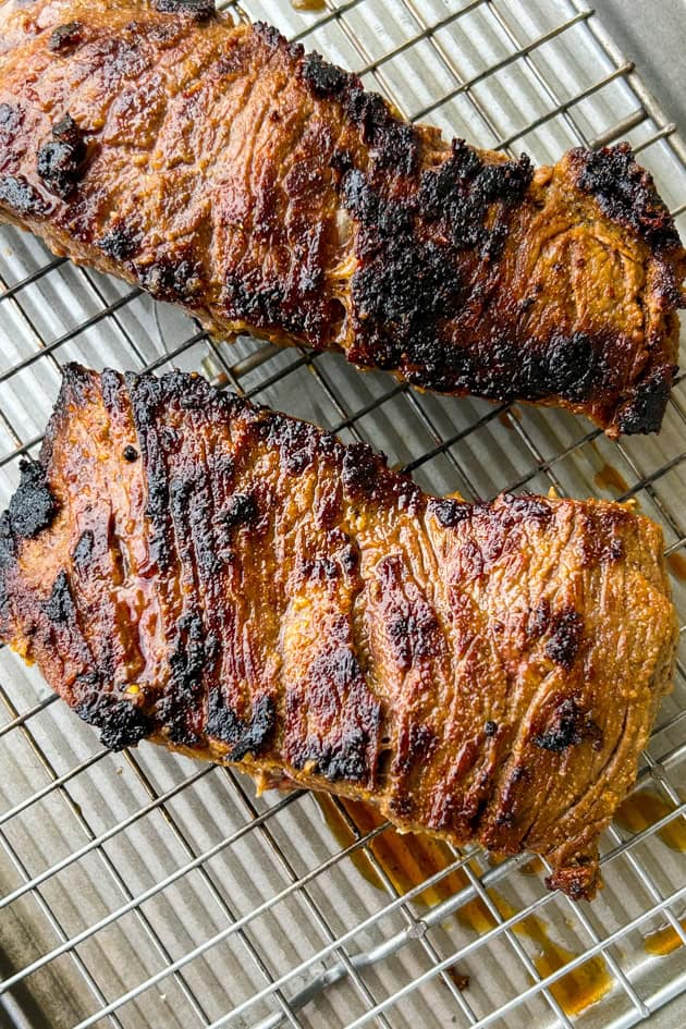 mojo marinated steak seared in a cast-iron pan