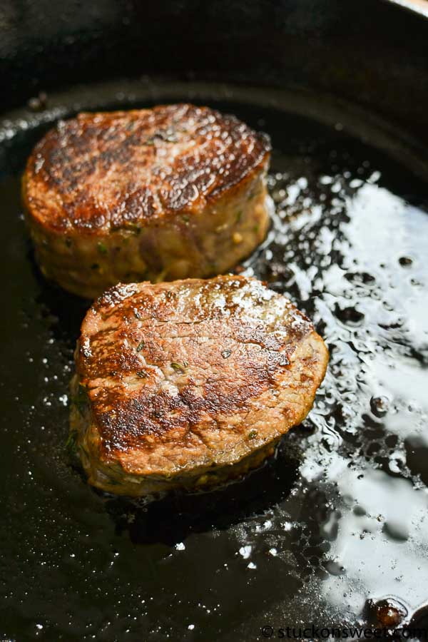 crusty filet mignons in cast iron skillet