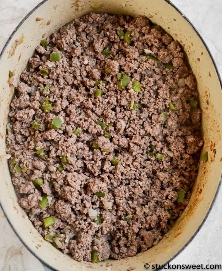 cooked ground beef, onion, garlic green pepper in a dutch oven