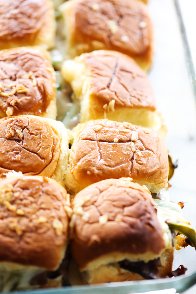 These Philly Cheese Steak Sliders are the ideal treat for game days, gatherings, or family dinners. Stuffed with tender roast beef, vibrant green peppers, creamy provolone cheese, sautéed onions, and a slather of mayonnaise, this dish is sure to delight everyone and keep them coming back for seconds!