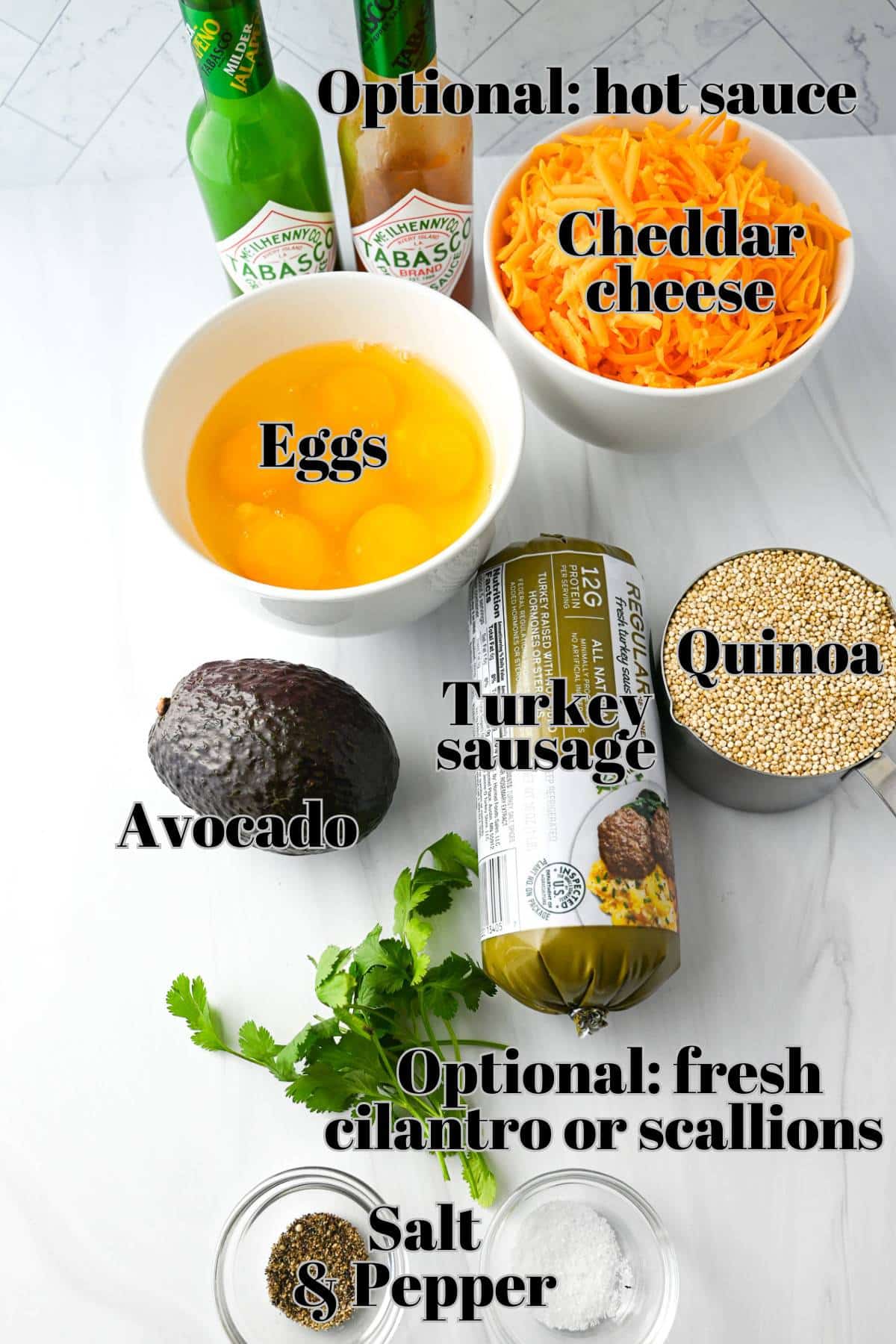 Ingredient layout for making quinoa breakfast bowls featuring egg, cheese, and avocado.